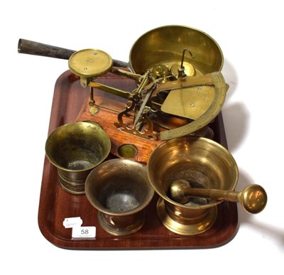 Lot 58 - Three pestle and mortars together with a set of postage scales and weights and a brass pan
