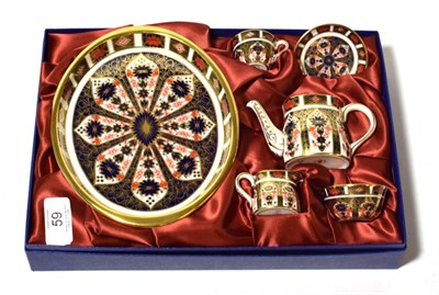 Lot 59 - A Royal Crown Derby Imari pattern miniature cabaret set including: a tray, cup and saucer,...