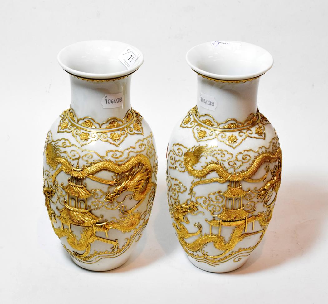 Lot 71 - A pair of 20th century Chinese porcelain baluster vases, applied with gilt metal dragon and...