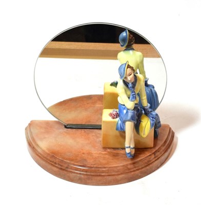 Lot 96 - An Art Deco table mirror with a porcelain seated figure