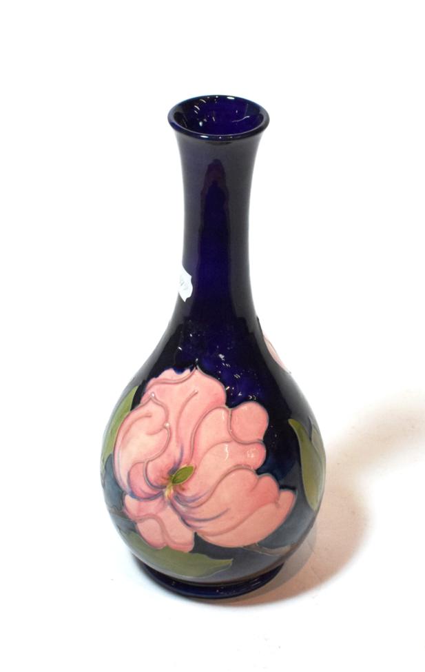 Lot 97 - A Walter Moorcroft bottle vase, signed to base, 32cm high