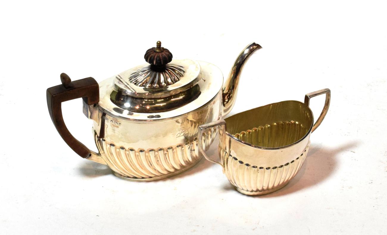 Lot 106 - A Victorian silver teapot and a similar sugar-bowl, the teapot maker's mark HH, possibly for...
