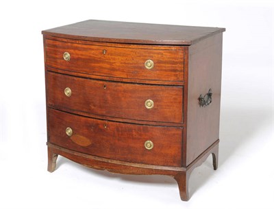 Lot 1204 - A Regency Mahogany and Ebony Strung Bowfront Dressing Chest, circa 1820, the hinged lid with reeded