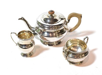Lot 109 - A three-piece George V silver tea-service, by the Goldsmiths and Silversmiths Co. Ltd., London,...
