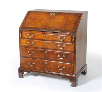 Lot 1205 - A George II Walnut and Boxwood Strung Bureau, early 18th century, the hinged slope inset with a...