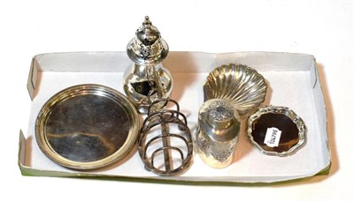 Lot 117 - A collection of silver, including: a George III silver teapot-stand, marks rubbed, London,...