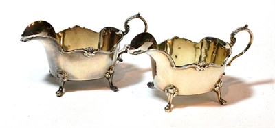 Lot 120 - A pair of George V silver sauceboats, by 	Manoah Rhodes & Sons Ltd., London, 1929, each oblong...