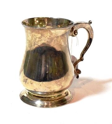 Lot 124 - A George III silver mug, by John Payne, London, 1764, baluster and on spreading foot, with...