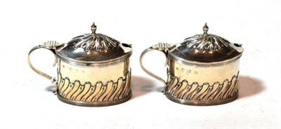 Lot 126 - A pair of Victorian silver mustard-pots, by Samuel Walton Smith, Birmingham, 1894, each oval...