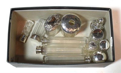 Lot 137 - A collection of assorted silver-mounted glass dressing-table jars and scent-bottles, including:...