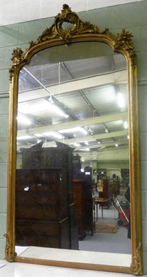 Lot 1209 - A Victorian Gilt and Gesso Overmantel Mirror, mid 19th century, the rectangular arched mirror plate