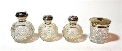 Lot 163 - A pair of Edward VII silver-mounted glass scent-bottles, the globular body hob-nail cut, the silver