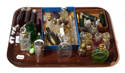 Lot 164 - A tray of various glass and silver-mounted glass scent bottles and perfume bottles, including...