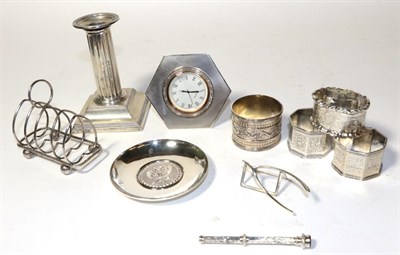 Lot 177 - A collection of silver, including: a George V silver-mounted timepiece, by Adie Brothers,...