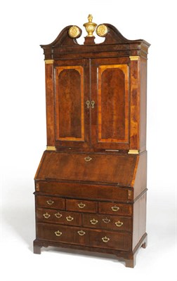 Lot 1211 - An Impressive George II Walnut, Crossbanded, Featherbanded and Parcel Gilt Bureau Bookcase in three