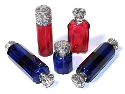 Lot 181 - Three silver mounted blue glass scent bottles; and two silver mounted ruby glass scent bottles (5)