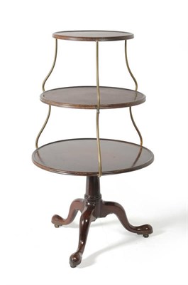 Lot 1214 - A George III Mahogany Three-Tier Circular Dumb Waiter, late 18th century, with S shaped brass...