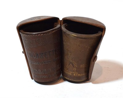 Lot 226 - Two leather cups, one stamped ''Johnnie Walker Whisky''; the other ''Scissors Cigarettes W.D &...