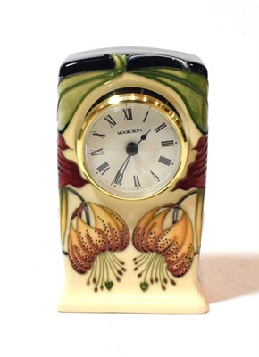 Lot 227 - A Moorcroft clock, signed and dated 98, boxed, 16cm high