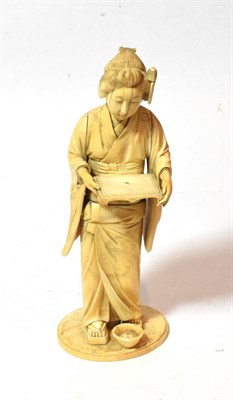 Lot 239 - A late 19th century Japanese ivory sectional okimono figure of a lady, 28cm high