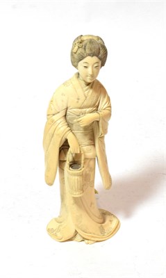 Lot 240 - A late 19th century Japanese ivory okimono of a lady, 23cm high