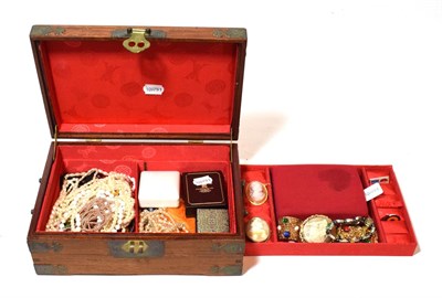 Lot 244 - A Chinese style hardwood box containing silver floral brooch; a locket and chain (a.f.); a...