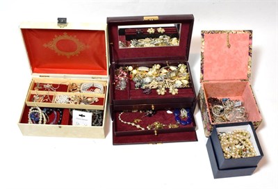 Lot 248 - A large quantity of costume jewellery in four small boxes including a Victorian brooch, an...