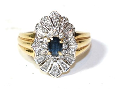 Lot 256 - An 18 carat gold sapphire and diamond undulating cluster ring, finger size P