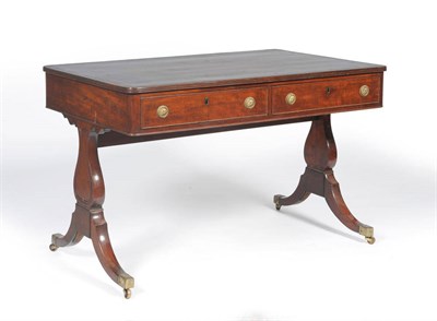 Lot 1218 - A Late George III Mahogany Writing Table, circa 1820, the rectangular brown and gilt skiver...