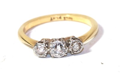 Lot 260 - A diamond three stone ring, stamped '18CT' and 'PLAT', finger size M1/2