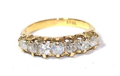 Lot 261 - A seven stone diamond ring, the graduated old cut diamonds in yellow claw settings, to a...