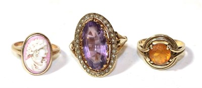 Lot 262 - A cameo ring, unmarked, finger size K; a 9 carat gold amethyst and seed pearl ring, out of...