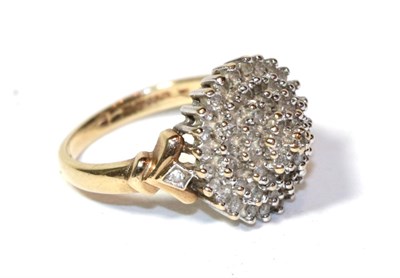 Lot 263 - A 9 carat gold five tier diamond cluster ring, finger size N
