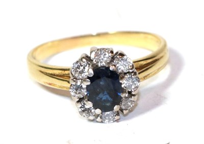 Lot 266 - An 18 carat gold diamond and sapphire ring, finger size N