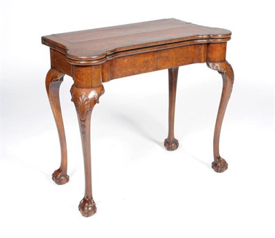 Lot 1219 - A George II Walnut, Crossbanded and Feather Banded Card Table, mid 18th century, the...