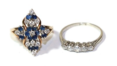 Lot 268 - A 9 carat gold sapphire and diamond cluster ring, finger size M; and a diamond five stone ring,...