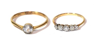 Lot 286 - A diamond five stone ring, stamped '18CT & PT', finger size O1/2; and a paste set solitaire...