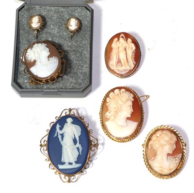 Lot 292 - Two cameo brooches in a frame stamped '9CT'; a pair of cameo earrings, stamped '9CT', with...