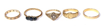 Lot 296 - A 9 carat gold band ring, finger size T; a 9 carat gold buckle ring, finger size Q; and three...