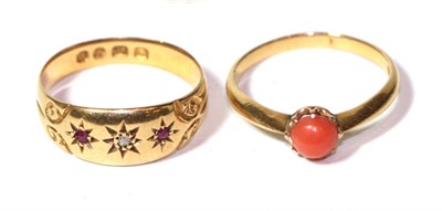 Lot 298 - A 18 carat gold ruby and diamond three stone ring, finger size Q; and a coral ring stamped...