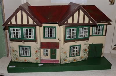 Lot 305 - Triang circa 1930's doll house; together with 1930's and later furniture; accessories; and a windup