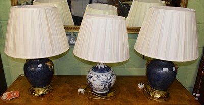 Lot 312 - A modern Chinese blue and white table lamp, with pleated shade; and a pair of Chinese style...