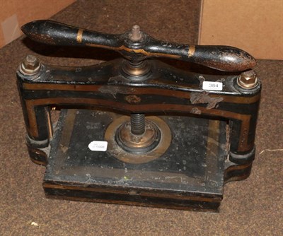 Lot 384 - A screw book press, black with gold decoration (a.f.)