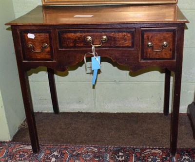 Lot 429 - An 18th century oak and mahogany crossbanded dressing table, with three drawers, 78cm wide