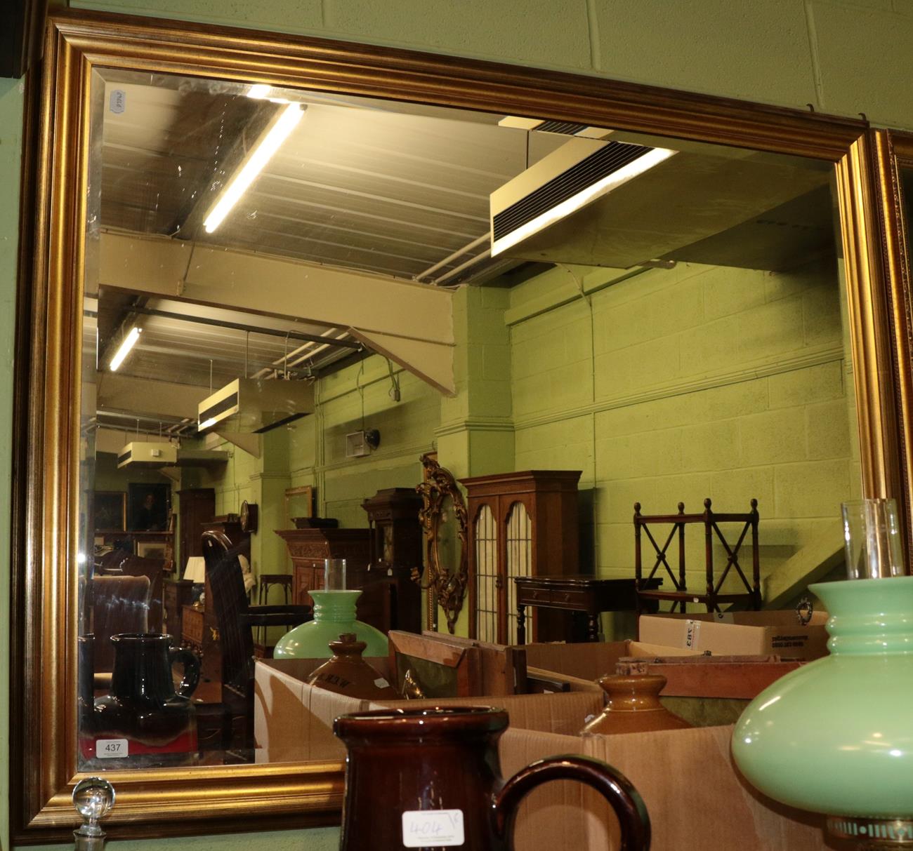 Lot 437 - A reproduction bevelled glass mirror, 107cm by 134cm