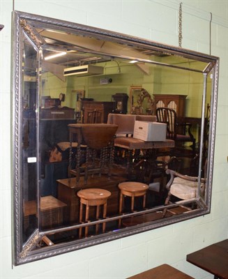 Lot 441 - A reproduction bevelled glass sectional mirror with silvered frame, 115cm by 146cm