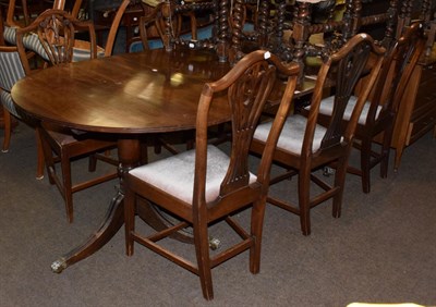 Lot 446 - A George III style twin pedestal mahogany extending dining table; and a set of six late 19th...