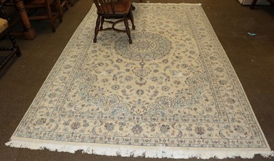 Lot 456 - A part silk Nain carpet, the ivory field of scrolling vines around a flower head medallion,...