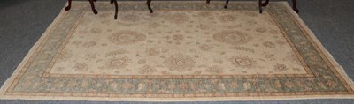 Lot 457 - An Afghan Ziegler rug, the ivory field of flower heads and vines enclosed by meandering vine...