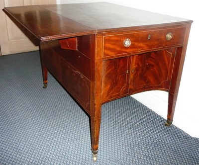 Lot 1237 - A George III Mahogany and Boxwood Strung Supper Table, circa 1800, the single drop leaf above...